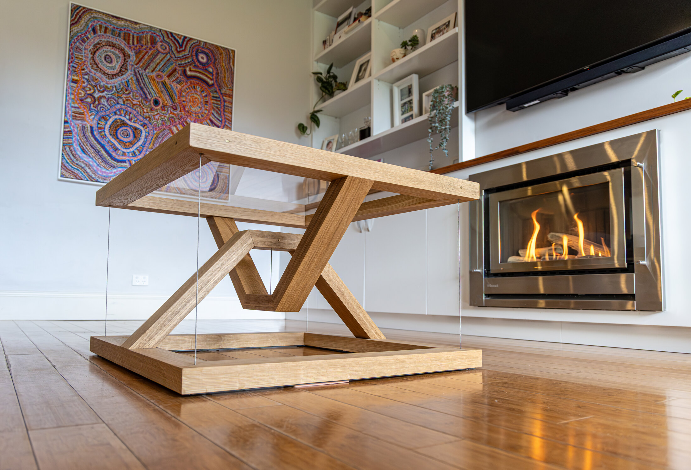 The finished Tensegrity Coffee Table in American oak with glass top