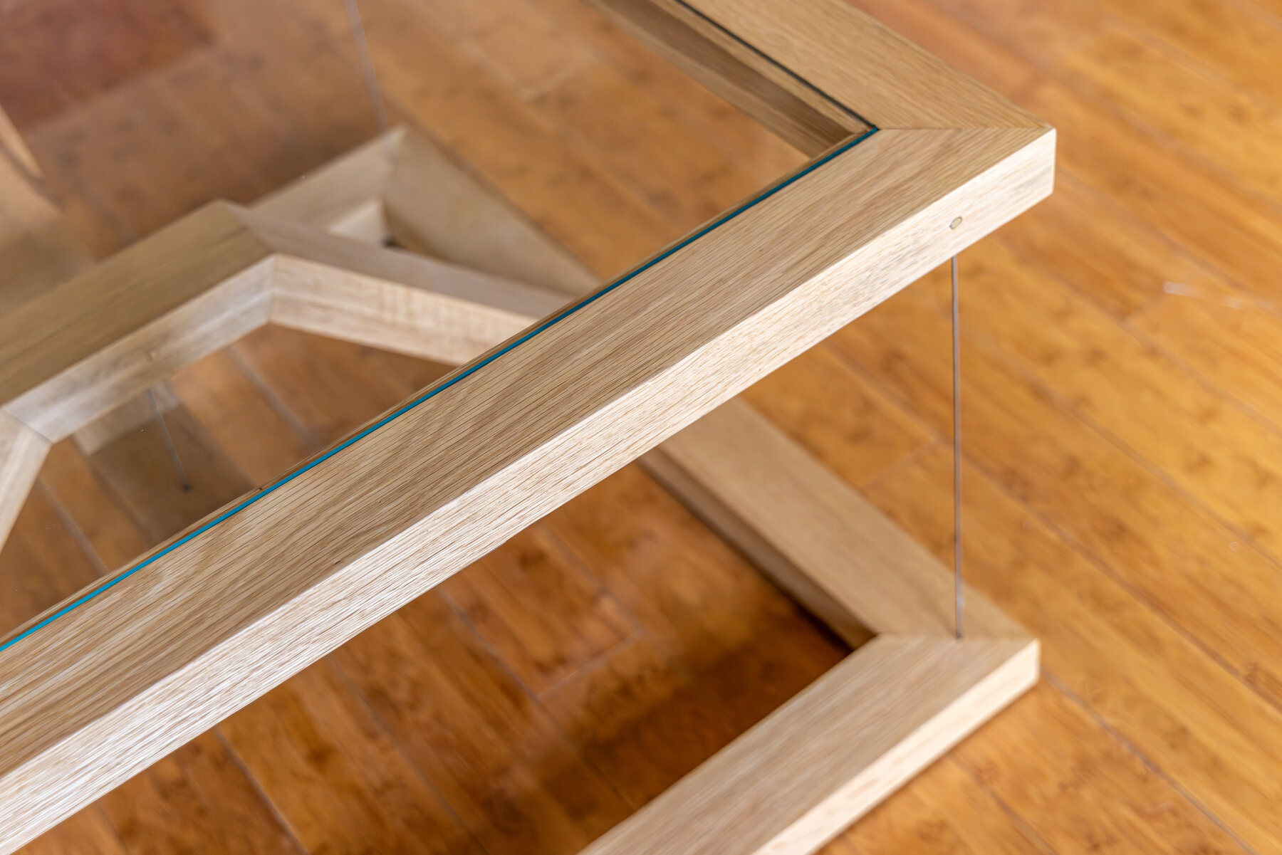 Glass top meeting the grain matched oak arc