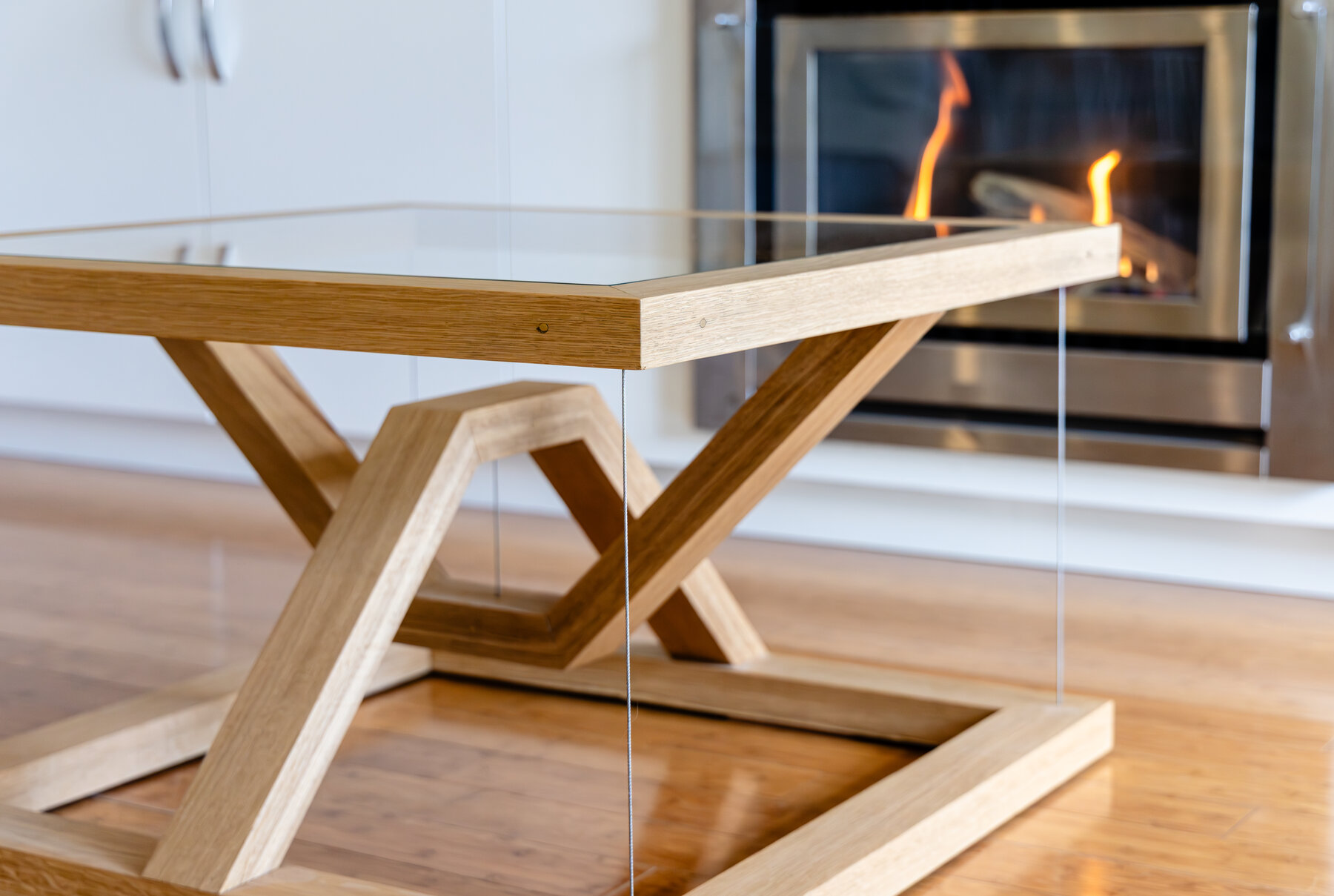 Tensegrity table side profile beside the fireplace